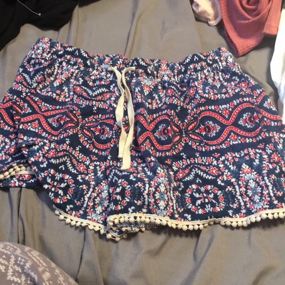 blue, red and white colored shorts with pattern